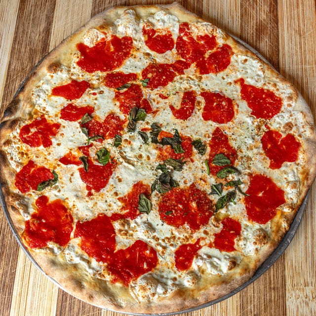 Homemade Fresh Mozzarella, Crushed Tomato & Basil Pizza.